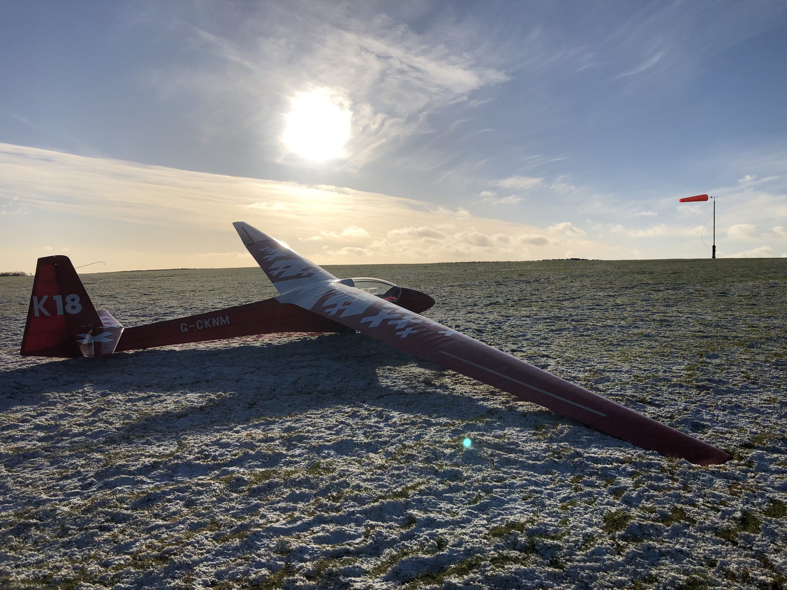 K18 KNM on a frosty airfield at sunset